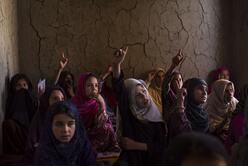 Girls attend class at one of several small schools that were established as part of the International Rescue Committee's community based education program in eastern Kabul's Pul-i-Sheena area.