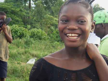 Smiling girl Orphaned Anita at an IRC-run children's center in the DRC