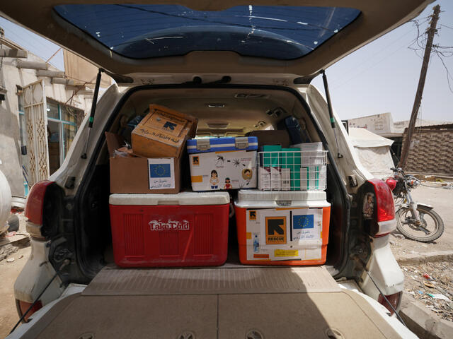 Image of open car boot packed with supplies