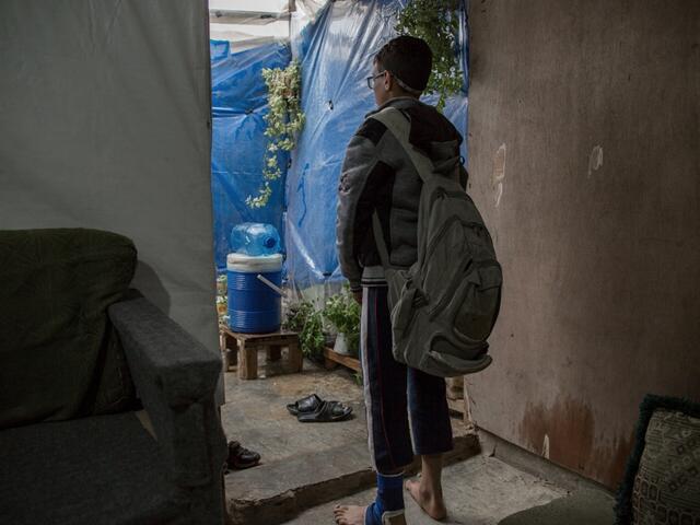 Bilal sets off to school from his home in an informal settlement near Tripoli, Lebanon.