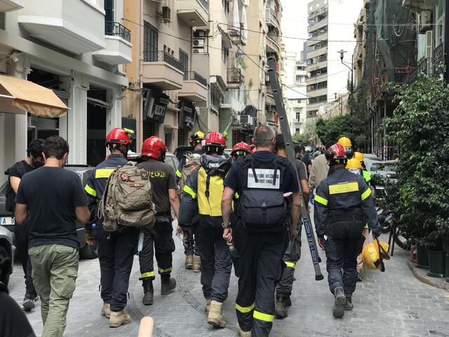 Beirut emergency responders walking down the street.