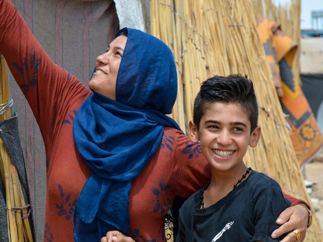 Yasser and his mother smiling.