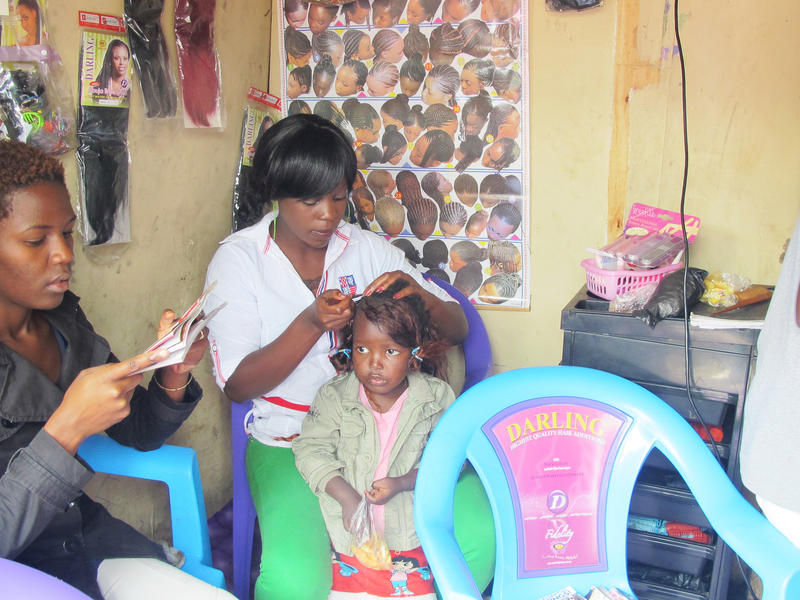 Susan braids a girl's hair