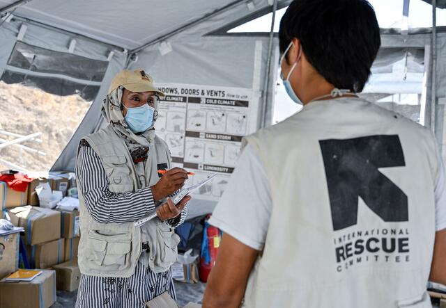 Two IRC staff members in a tent