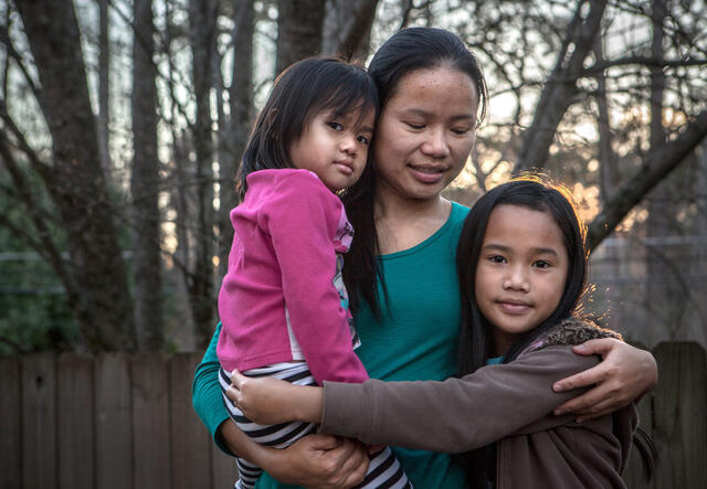 Klaw Htoo with her daughters Gloria and Sophia at their new home in Atlanta