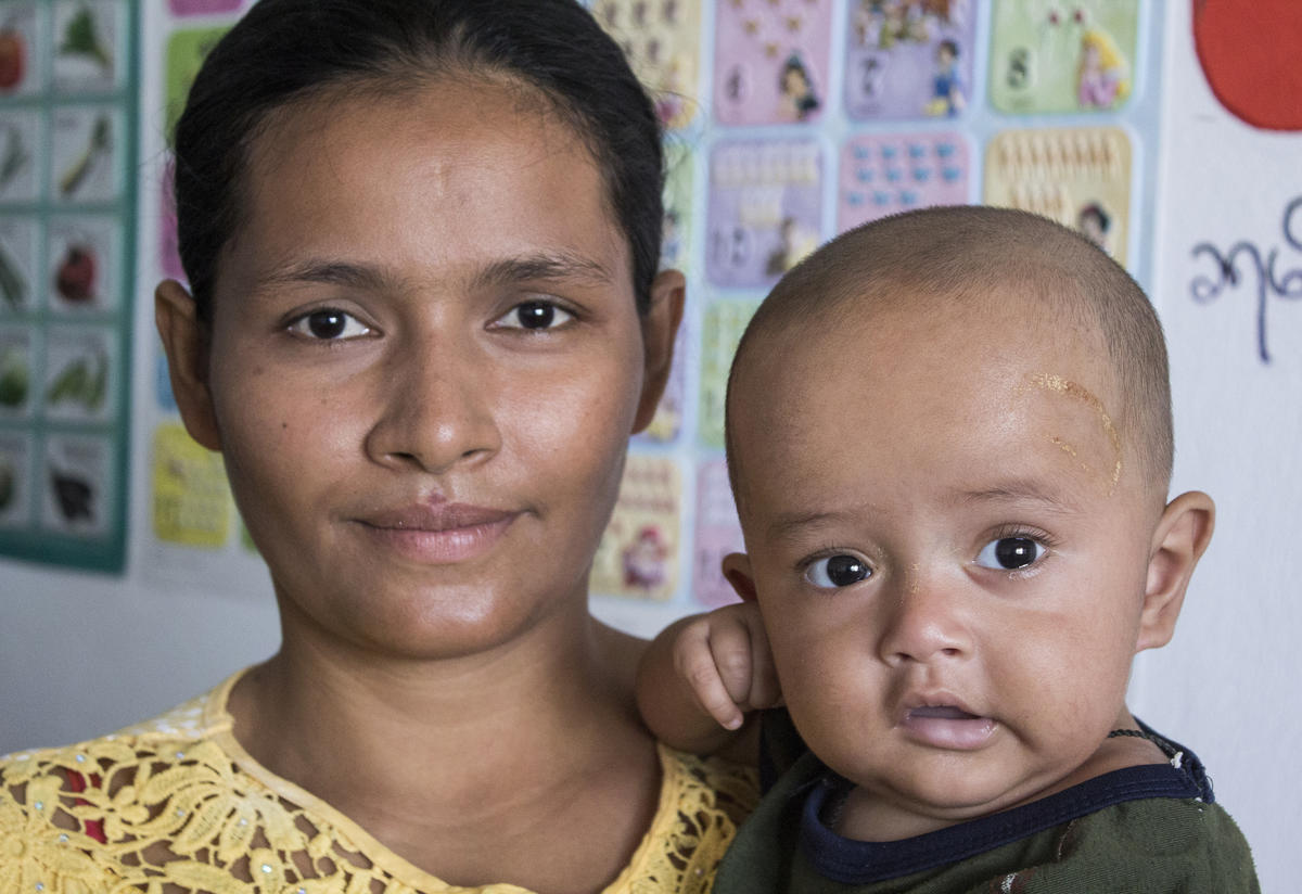 A mother with her child at a health clinic A mother with her child at a health clinic